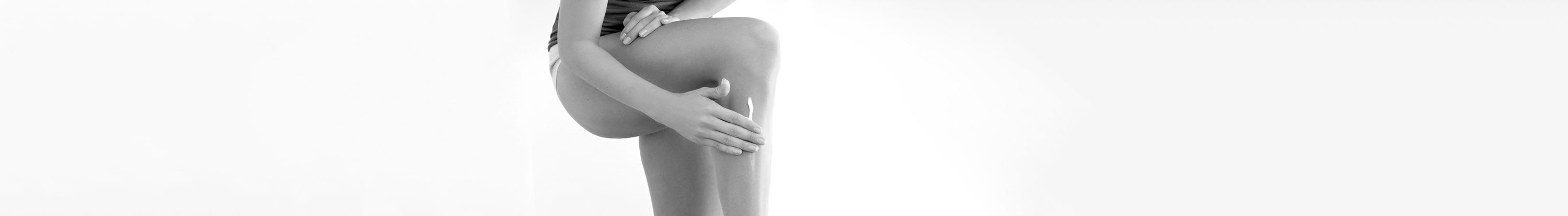 Woman touching her left leg